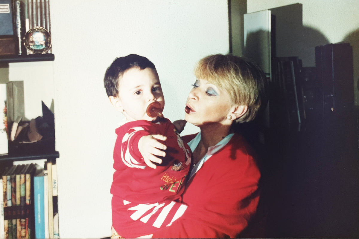Archival photo of a mom holding her baby son, Maria Cristina Mezzani and Filippo Fornasini, creators of MarMar Genova, from the early 1990s