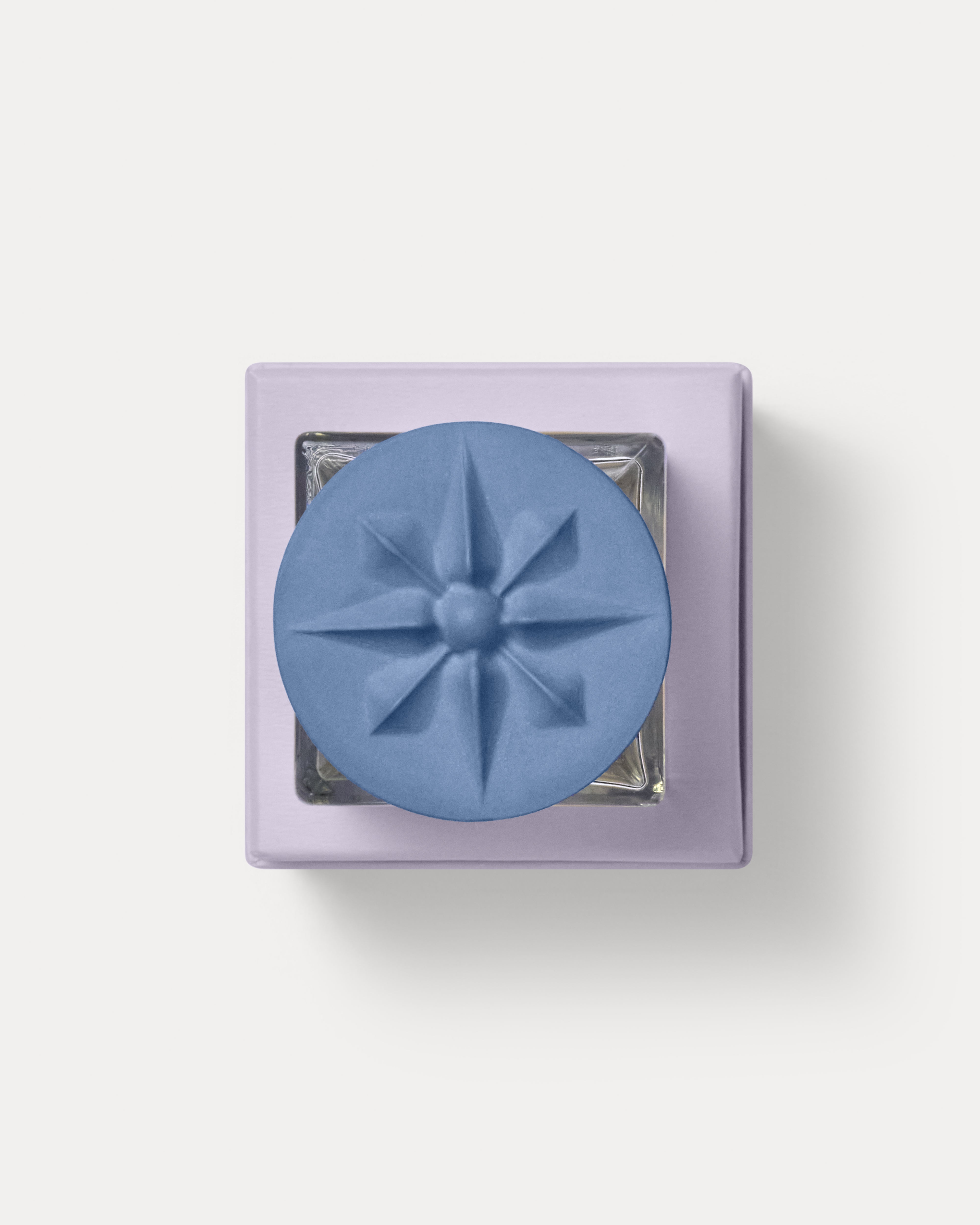 Topshot view of the Creuza d'Amar eau de parfum grès stoneware cap in lilac box by MarMar Genova