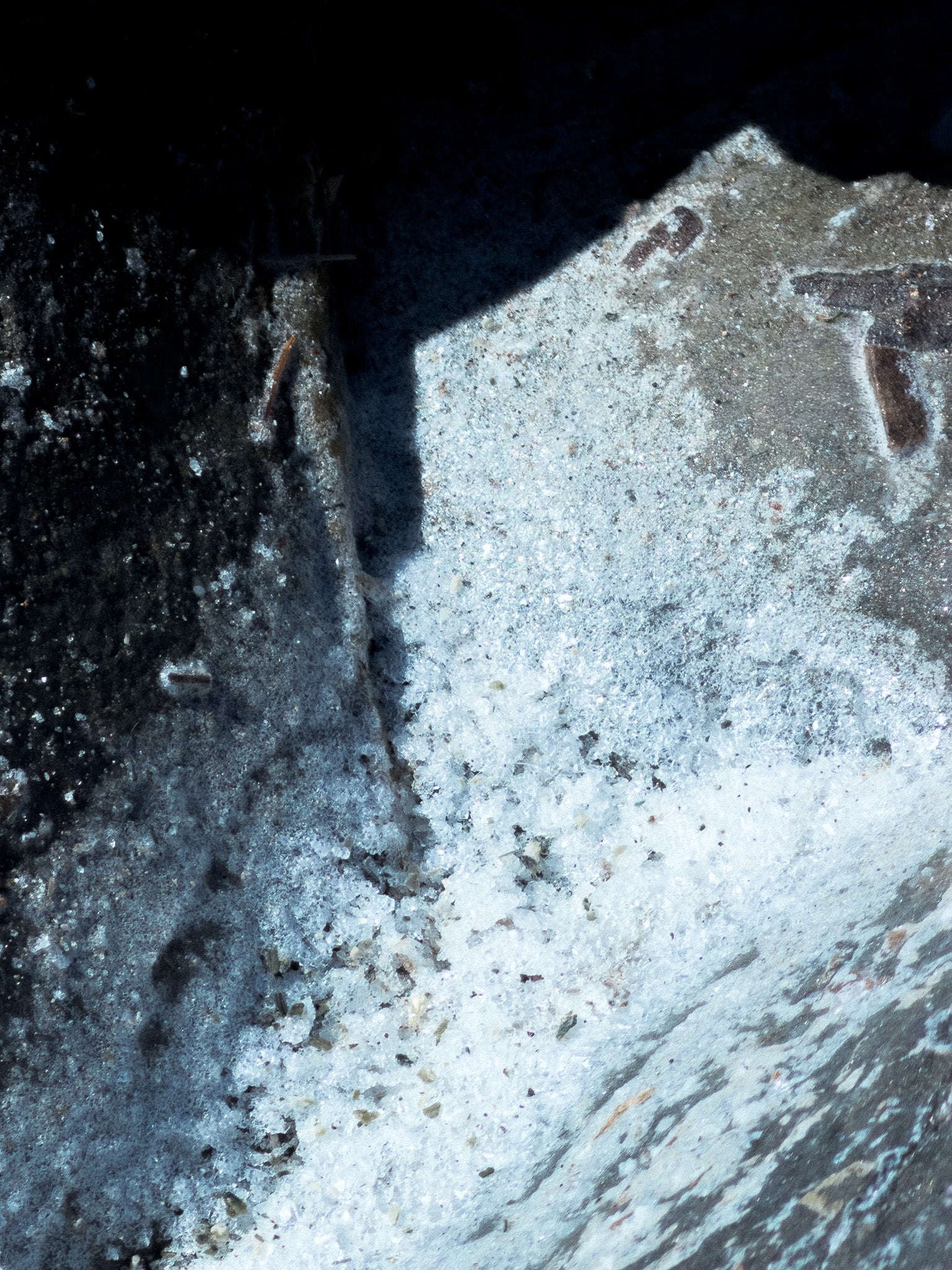 Macro shot of sea salt dried up on a gray rock for MarMar Genova